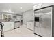 Spacious kitchen featuring stainless steel appliances, granite countertops, and tiled floors at 3908 Alafia Blvd, Brandon, FL 33511