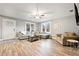 Bright living room with hardwood floors, large windows and comfortable seating at 3908 Alafia Blvd, Brandon, FL 33511