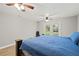 Bright bedroom featuring ceiling fans and a set of french doors for accessing the backyard at 3908 Alafia Blvd, Brandon, FL 33511
