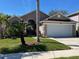 Charming single-Gathering home with a two-car garage and well-manicured front lawn at 4029 Savage Station Cir, New Port Richey, FL 34653