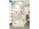 Modern bathroom features glass enclosed shower, tile surround, and unique shelving for toiletries at 4135 Beach Se Dr, St Petersburg, FL 33705