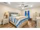 The cozy bedroom features a ceiling fan and a beautifully coordinated decor scheme at 4135 Beach Se Dr, St Petersburg, FL 33705