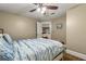 Bedroom featuring hardwood floors, a closet, ceiling fan, and view into the house at 4135 Beach Se Dr, St Petersburg, FL 33705