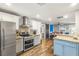 A stylish kitchen features stainless steel appliances, and gray and white cabinetry at 4135 Beach Se Dr, St Petersburg, FL 33705