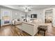 Comfortable living room with hardwood floors, ceiling fan, stylish decor, and open access to other areas of the home at 4135 Beach Se Dr, St Petersburg, FL 33705