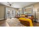 This living room features a cozy seating area, a ceiling fan, and a sliding glass door at 4135 Beach Se Dr, St Petersburg, FL 33705