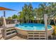 The backyard offers an above ground pool surrounded by lush tropical foliage at 4135 Beach Se Dr, St Petersburg, FL 33705
