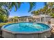 Inviting backyard features a sparkling above-ground pool and relaxing outdoor space at 4135 Beach Se Dr, St Petersburg, FL 33705