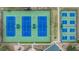 Overhead aerial image of green and blue tennis courts in a residential community at 5088 Championship Cup Ln, Spring Hill, FL 34609