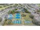 Overhead view of community amenities including tennis courts, pool, and clubhouse surrounded by neighborhood homes at 5088 Championship Cup Ln, Spring Hill, FL 34609