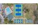 Overhead view showcasing the pool, tennis courts, and basketball court amenities in the community at 5088 Championship Cup Ln, Spring Hill, FL 34609