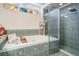 Close up of bright bathroom featuring soaking tub, glass shower, and tiled accents at 5088 Championship Cup Ln, Spring Hill, FL 34609