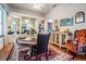 Inviting dining room with a round table, decorative rug, and glass shelving for displaying art at 5088 Championship Cup Ln, Spring Hill, FL 34609