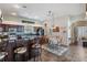 Open kitchen with wooden cabinets, granite countertops, and breakfast bar seating at 5088 Championship Cup Ln, Spring Hill, FL 34609