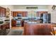 Elegant kitchen with wooden cabinetry, stainless steel appliances, and granite countertops at 5088 Championship Cup Ln, Spring Hill, FL 34609