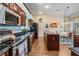 Well-equipped kitchen with stainless appliances, granite counters, and tile floors, perfect for cooking at 5088 Championship Cup Ln, Spring Hill, FL 34609