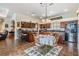 Spacious kitchen with wooden cabinets, granite countertops, and a central island with seating at 5088 Championship Cup Ln, Spring Hill, FL 34609