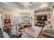 Cozy living room with tile floors, comfortable seating, and a view of the pool at 5088 Championship Cup Ln, Spring Hill, FL 34609