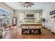 Comfortable main bedroom with decorative ceiling fan, sitting area, bench seat and natural light at 5088 Championship Cup Ln, Spring Hill, FL 34609