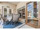 Cozy outdoor patio area featuring comfortable seating and views of the screened-in pool, perfect for relaxation at 5088 Championship Cup Ln, Spring Hill, FL 34609