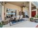 Spacious outdoor patio featuring ample seating, ceiling fans, and access to the pool area, ideal for entertaining at 5088 Championship Cup Ln, Spring Hill, FL 34609