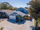 Aerial view of a two-story home boasting a brick driveway and manicured landscaping at 5526 14Th S Ave, Gulfport, FL 33707