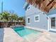 Backyard with pool, raised stone planters, and travertine tile at 5526 14Th S Ave, Gulfport, FL 33707