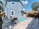 Backyard featuring a pool, deck, and an outdoor bar with a tiki hut for relaxing at 5526 14Th S Ave, Gulfport, FL 33707