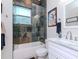 Bathroom with tiled shower/tub combo with glass door, toilet, and vanity with marble countertop at 5526 14Th S Ave, Gulfport, FL 33707