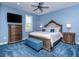 Blue themed bedroom with a decorative bed, side tables and dresser at 5526 14Th S Ave, Gulfport, FL 33707