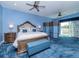 Blue themed bedroom with a decorative bed, blue carpet, screen and an exterior view at 5526 14Th S Ave, Gulfport, FL 33707