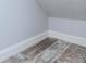 Corner of a room showcasing neutral-toned plank flooring and white trim at 5526 14Th S Ave, Gulfport, FL 33707