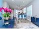 Open dining area with a modern chandelier and views into the kitchen at 5526 14Th S Ave, Gulfport, FL 33707