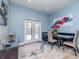 Dining area with a modern table, chairs, and a view of the backyard through glass doors at 5526 14Th S Ave, Gulfport, FL 33707