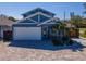 Charming two-story home featuring a lush landscaped yard, beautiful brick driveway, and a two-car garage at 5526 14Th S Ave, Gulfport, FL 33707