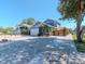 Lovely two-story home with a beautifully landscaped front yard and brick-paved driveway at 5526 14Th S Ave, Gulfport, FL 33707