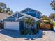 Beautiful two-story home with a lush yard and a brick-paved driveway at 5526 14Th S Ave, Gulfport, FL 33707