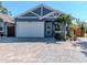 Charming single Gathering home featuring a well-manicured front yard and a large, attached two car garage at 5526 14Th S Ave, Gulfport, FL 33707