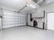 Spacious garage featuring epoxy flooring, work bench and storage cabinets at 5526 14Th S Ave, Gulfport, FL 33707