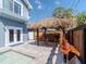 Poolside tiki bar with outdoor barstools, custom wood bar, and patio at 5526 14Th S Ave, Gulfport, FL 33707
