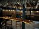 Outdoor bar with an epoxy finished bar top, bar stools, and tiki hut at 5526 14Th S Ave, Gulfport, FL 33707