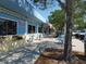 Charming retail building with patio seating and vibrant blue and yellow accents at 5526 14Th S Ave, Gulfport, FL 33707