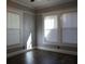 Inviting bedroom with natural light, wood-look floors, and fresh paint at 708 E Crenshaw St, Tampa, FL 33604