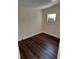 Neutral room with a window unit air conditioner and dark-toned wood-look flooring at 711 Smith St, Clearwater, FL 33756