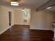 View of the open-concept living area, showcasing hardwood floors and natural light at 711 Smith St, Clearwater, FL 33756