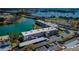 This is an aerial view of the condo building with views of the lake and several bridges in the distance at 7405 Bay Island S Dr # 220, South Pasadena, FL 33707