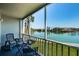 Scenic balcony with seating, offering stunning views of the water and surrounding landscape at 7405 Bay Island S Dr # 220, South Pasadena, FL 33707