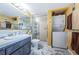 Bathroom includes a shower with glass doors and a laundry area at 7405 Bay Island S Dr # 220, South Pasadena, FL 33707