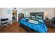 Spacious bedroom has wood-look floors and an ensuite bathroom at 7405 Bay Island S Dr # 220, South Pasadena, FL 33707