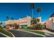 This is an exterior view of the condominium building showcasing the manicured landscaping and design at 7405 Bay Island S Dr # 220, South Pasadena, FL 33707